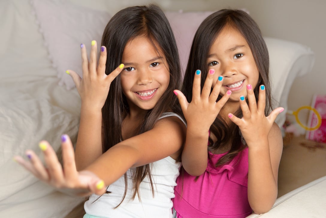 Little girl with painted nails